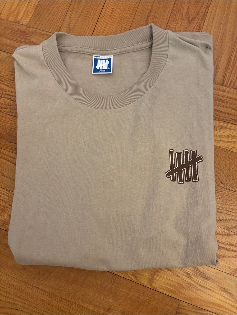 Undefeated Short Sleeve T-Shirt in Taupe with Brown Logo